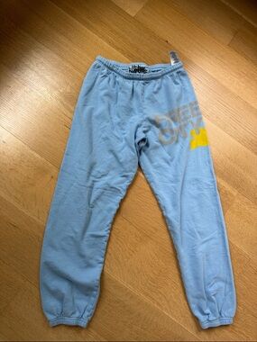 freecity Light Blue Track Joggers with Yellow Logo
